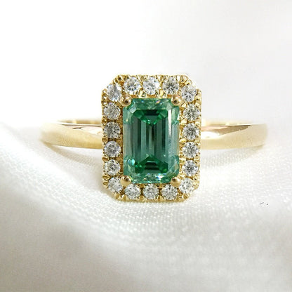 green emerald cut moissanite ring