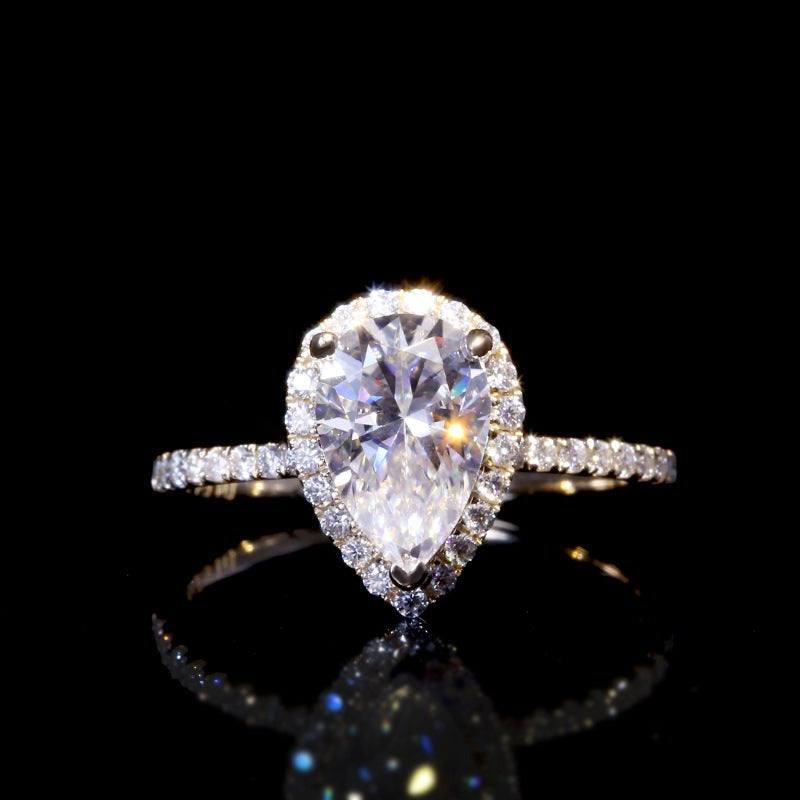 1.5 carat pear cut moissanite warp halo ring