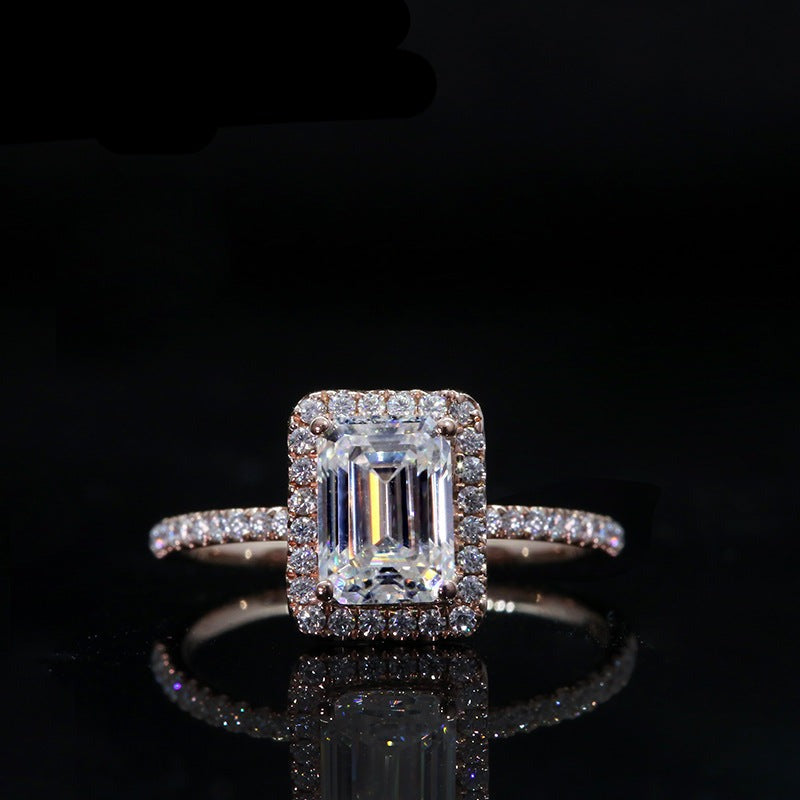 emerald cut moissanite wrap halo ring set in pave band